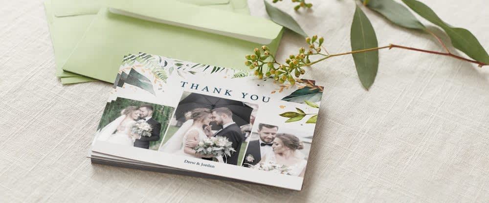A stack of custom wedding thank you cards