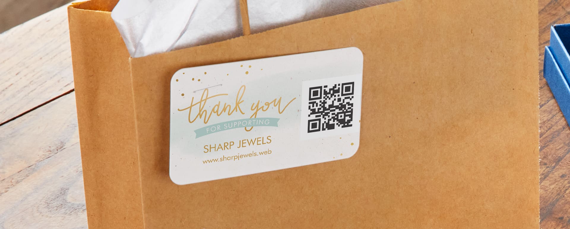 A custom QR code business card attached to a paper bag