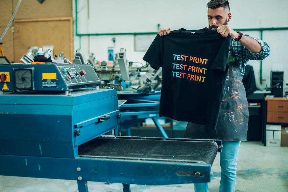 A printer makes a custom t-shirt test print