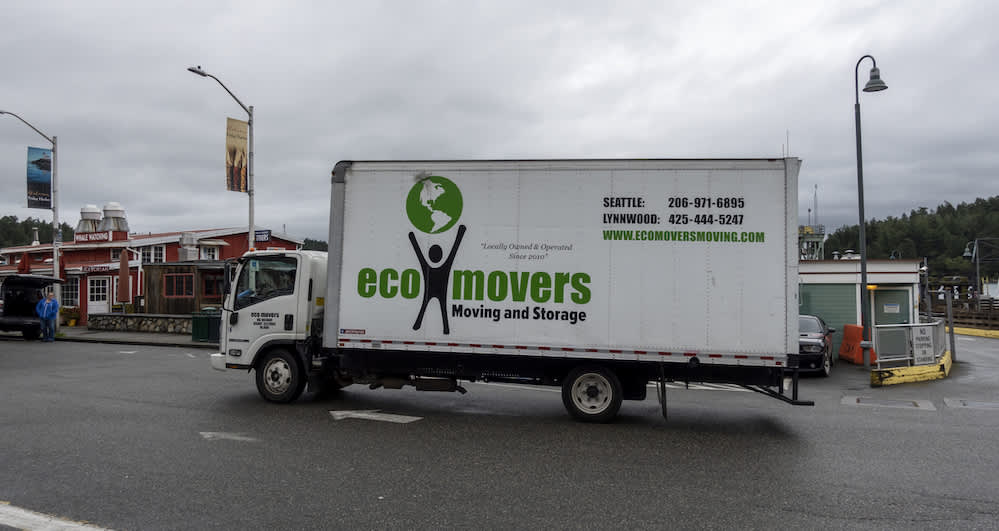 A moving truck with a branded logo