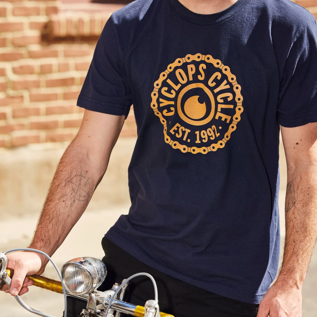 A cyclist wearing a branded T-shirt