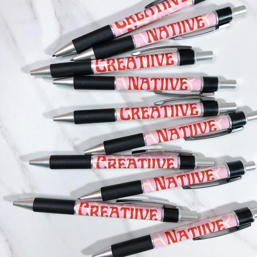 A pile of custom branded pens