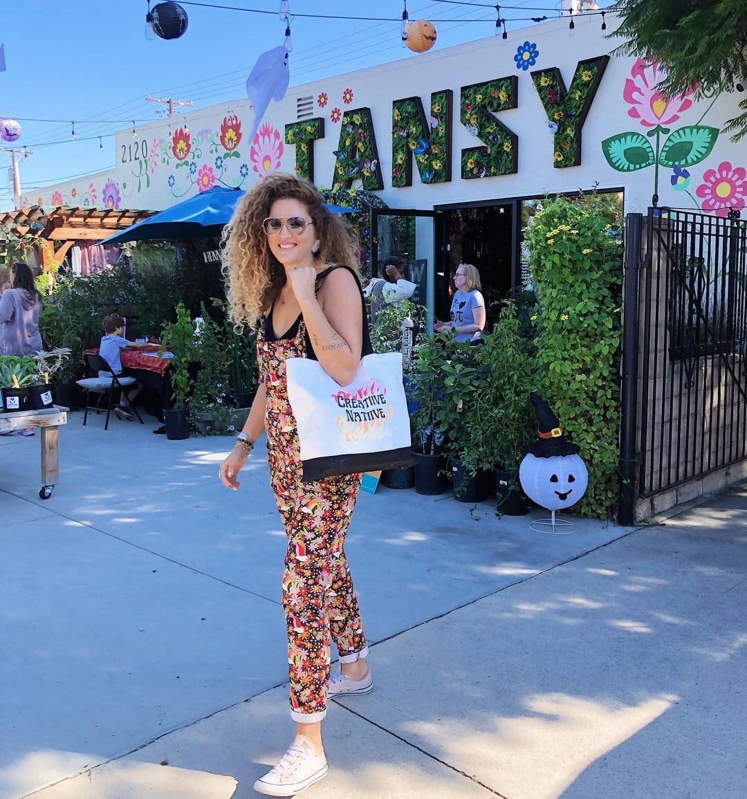 A small business owner with their branded tote bag
