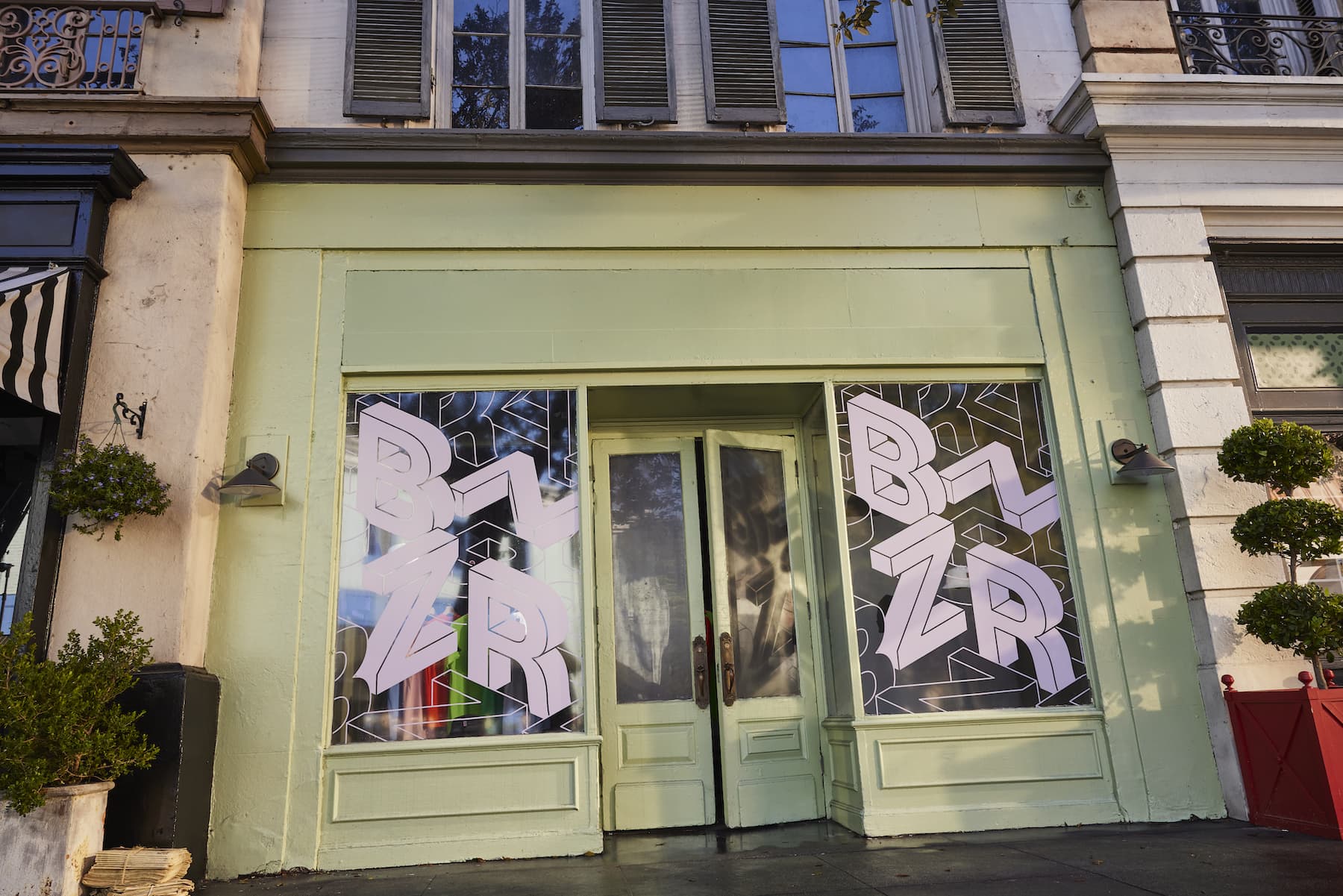 A storefront with colorful window signage
