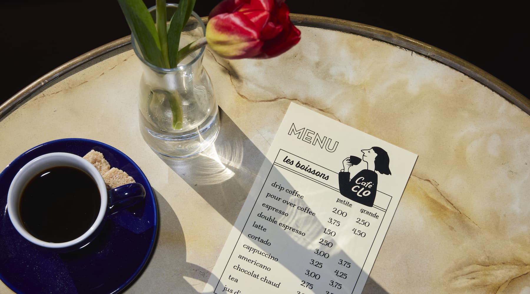 A branded cafe menu on a table